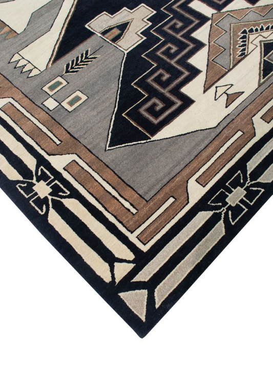Geometric patterned rug with brown, black, and gray colors on a white background