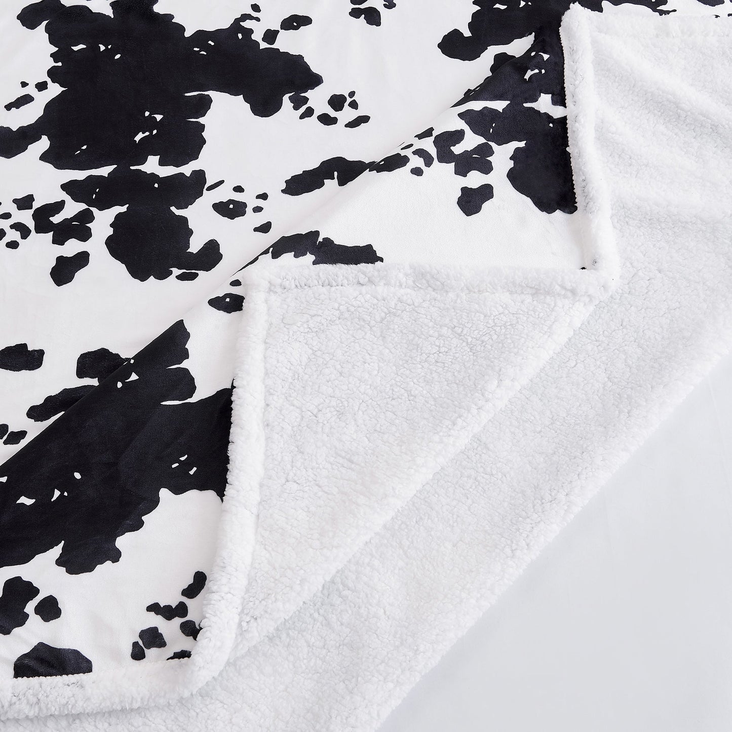 Elsa Cowhide Campfire Sherpa Throw