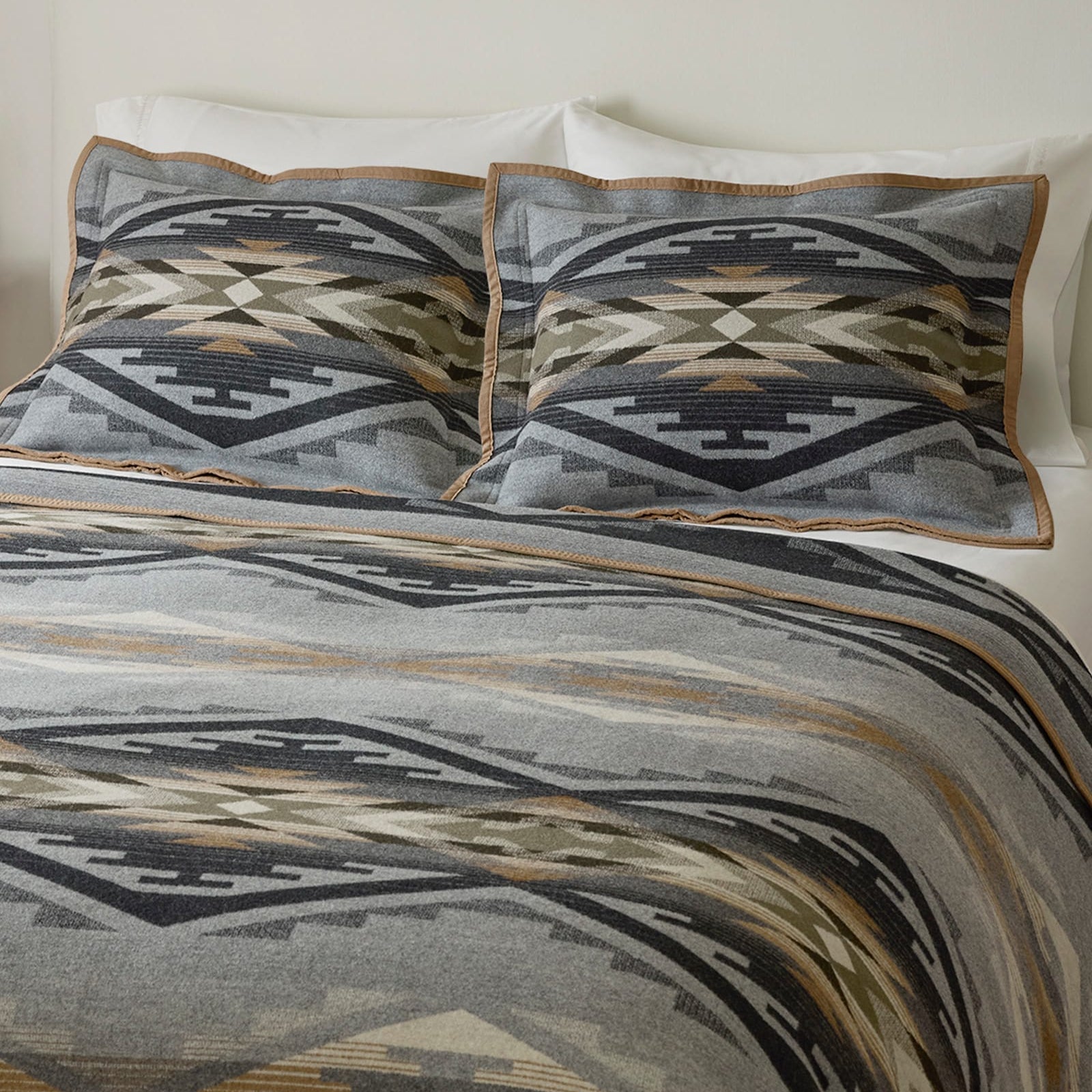 Bedding set with geometric pattern on a bed